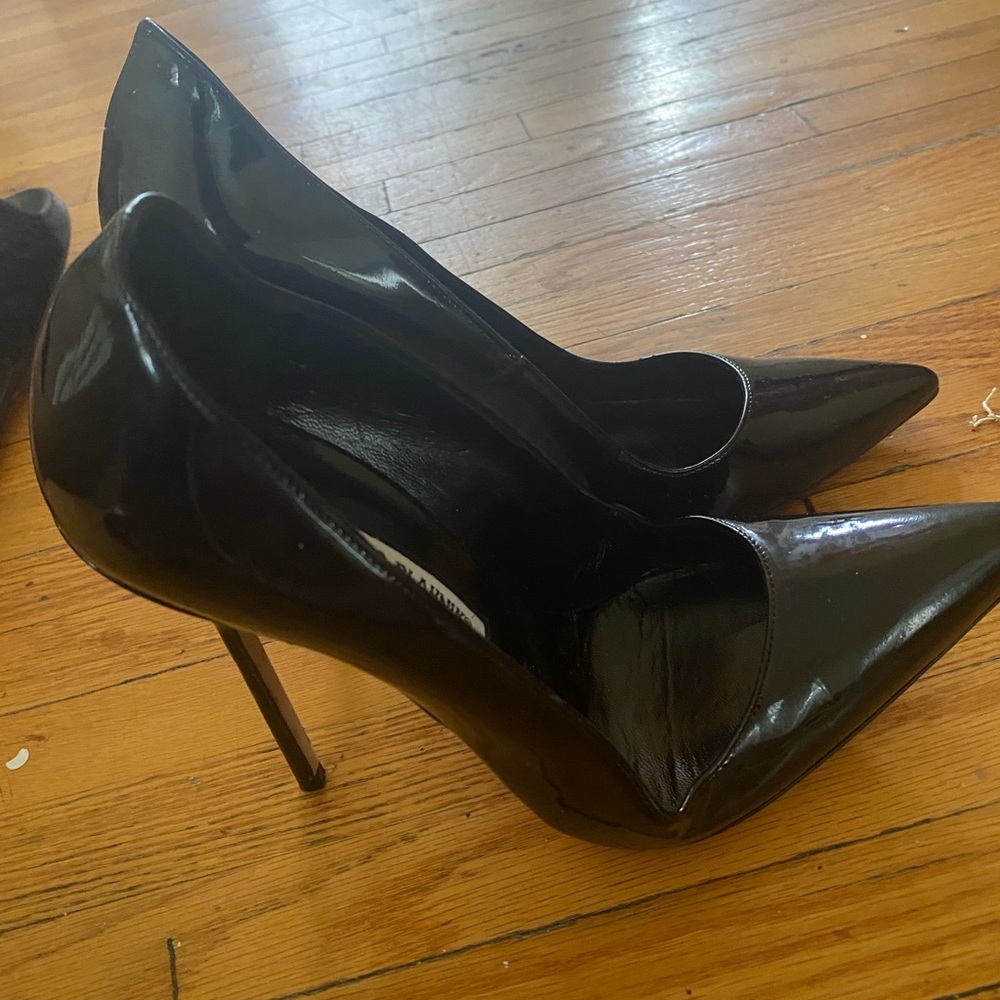 Manolo Blahnik patent leather pumps. These pumps run small if